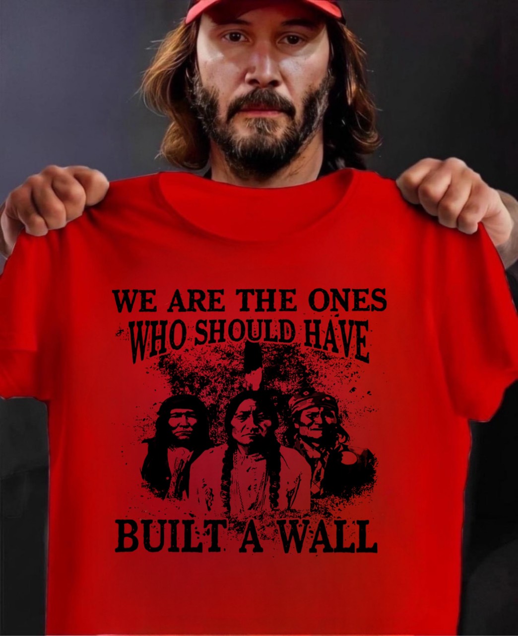Keanu Reeves holding T-Shirt: "We are the ones who should have built a wall"